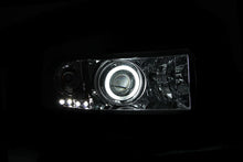 Cargar imagen en el visor de la galería, Faros delanteros con proyector ANZO 1994-2001 Dodge Ram con Halo cromado