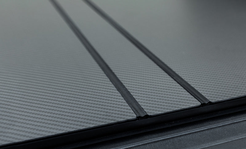 Access LOMAX Carbon Fiber Folding Hard Cover — 2022+ Rivian R1T 4ft 6in Bed