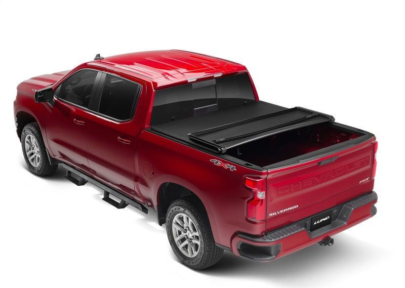 Cubierta de lona plegable triple Genesis para Chevy Silverado 1500 (caja de 6,5 pies) de Lund 14-17, color negro